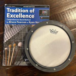 Percussion book. Tradition of Excellence book 2 and practice Remo 10” drum pad